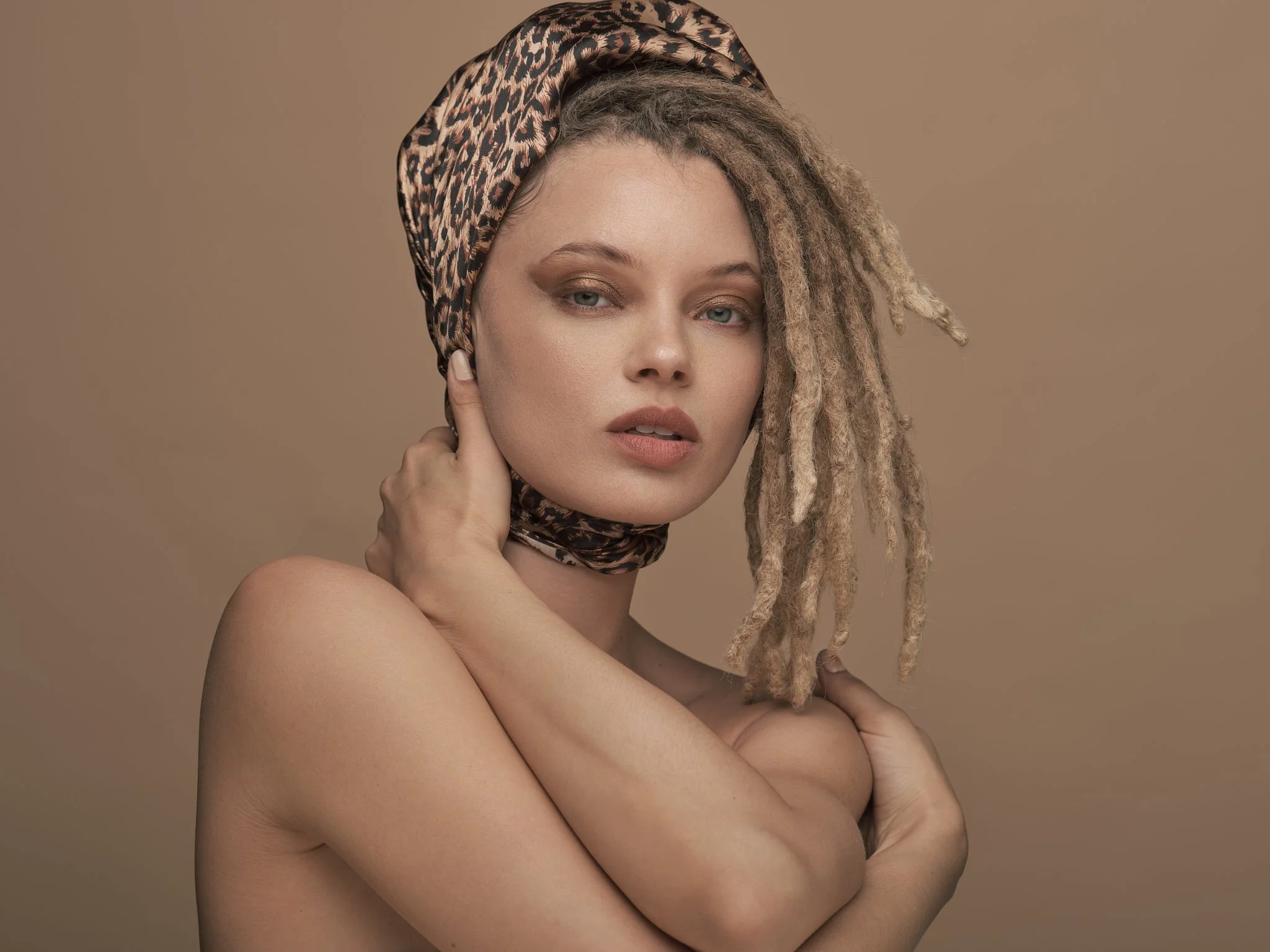 Portia Watznauer wrapped in an leopard print head scarf.