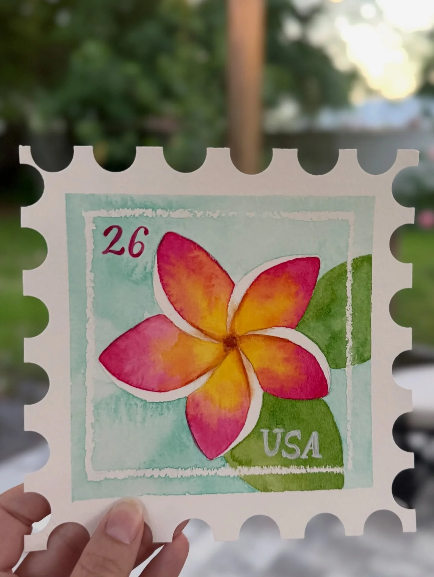 Get away for a morning and paint a tropical watercolor postage stamp (or card!). I&rsquo;ll guide you step by step through painting a vibrant plumeria/frangipani flower. We&rsquo;ll practice color-blending, wax resist, and brush technique. Whether yo