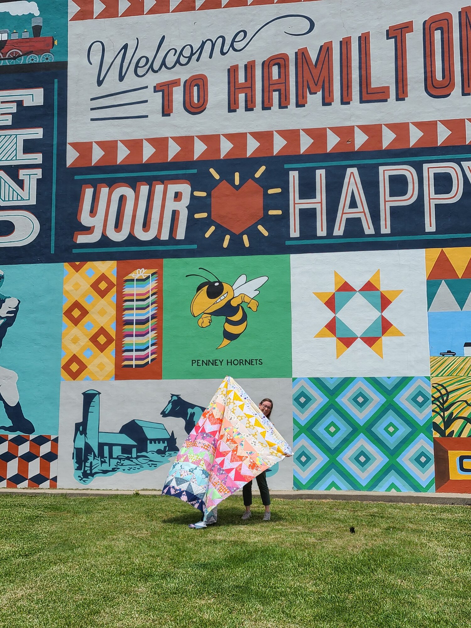 Sarah took her amazing quilt all the way to Quilt Town USA on a birthday trip and got this cute picture in front of the Hamilton, Missouri mural! Sarah is a nurse, a fur mama, and such a sweet and talented quilty friend! You can find her on IG @mtngalrn.