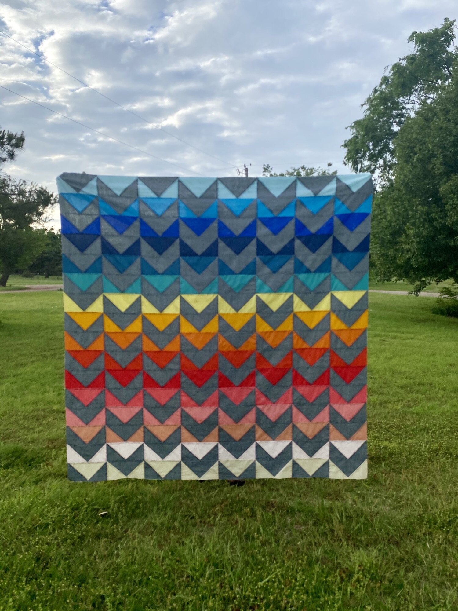 Abby included an extra flying geese block on each row making her quilt an extra snuggly size! I love the beautiful rainbow color transition in contrast with the grey background fabric. I can’t wait to see how she decides to finish this quilt! You can find Abby and her quilts on IG @abbygailroggenkamp.