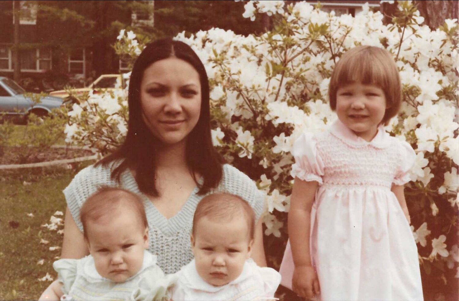 Here’s an old photo of my mom, my sisters and me… I think that’s me on the right in my mom’s lap, but honestly I’m not totally sure 😂 (my mom was the only one who always knew who was who).