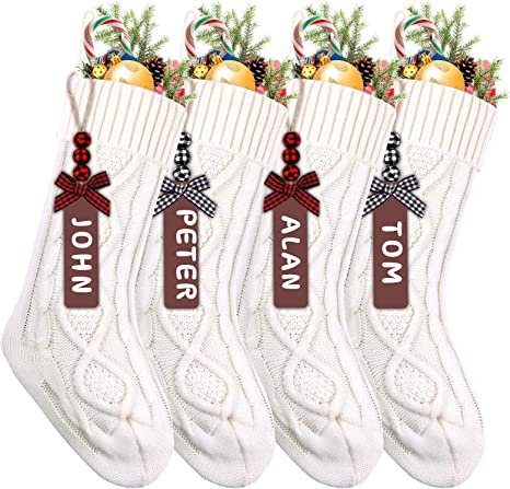 White cable knit Christmas stockings with name tags