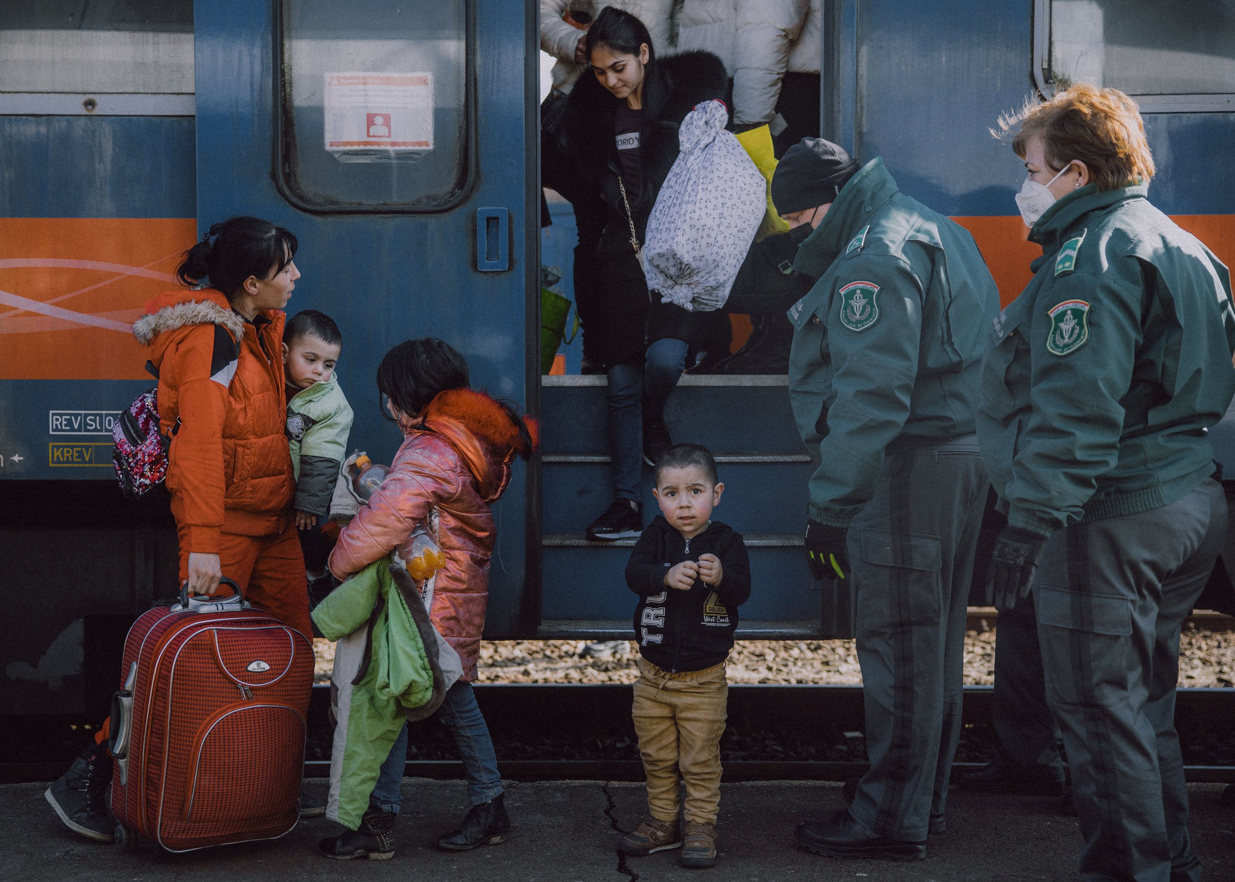  Hundreds of people arrive to the train station after crossing the border at Zahony-Csap as they flee Ukraine on February 27, 2022 in Zahony, Hungary 