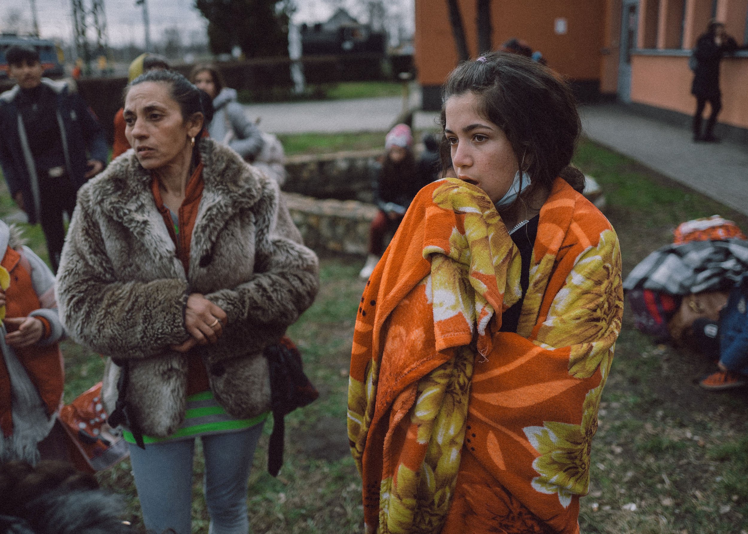  Roma family look for relatives at the train station after crossing the border at Zahony-Csap as they flee Ukraine on February 26, 2022 in Zahony, Hungary 
