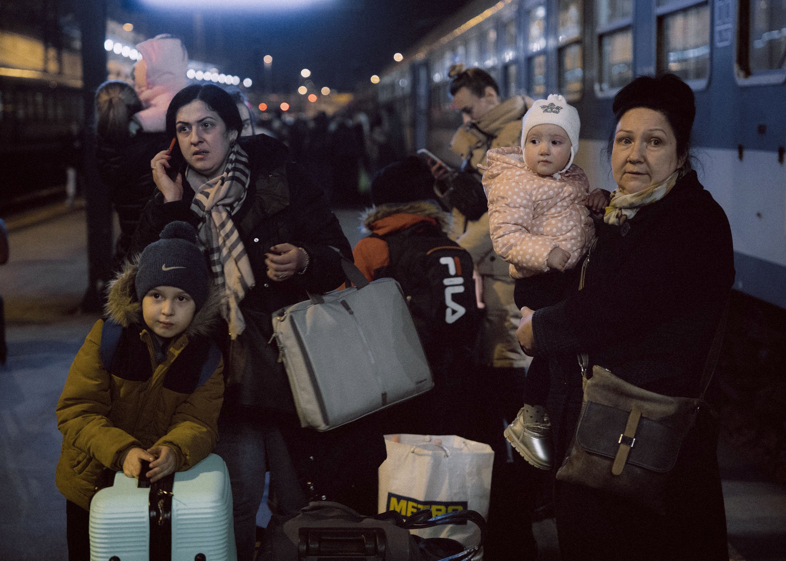  People arrive to the Western Railway Station from Zahony after crossing the border at Zahony-Csap as they flee Ukraine on March 03, 2022 in Budapest, Hungary 