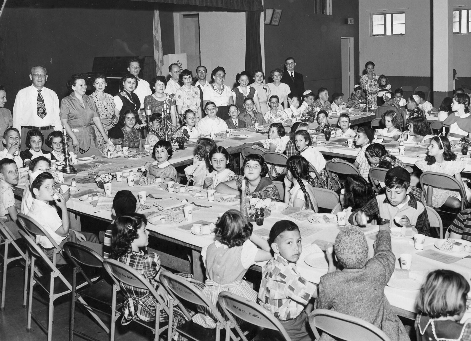 Group photo of Beth El congregation, showcasing a model seder in 1951