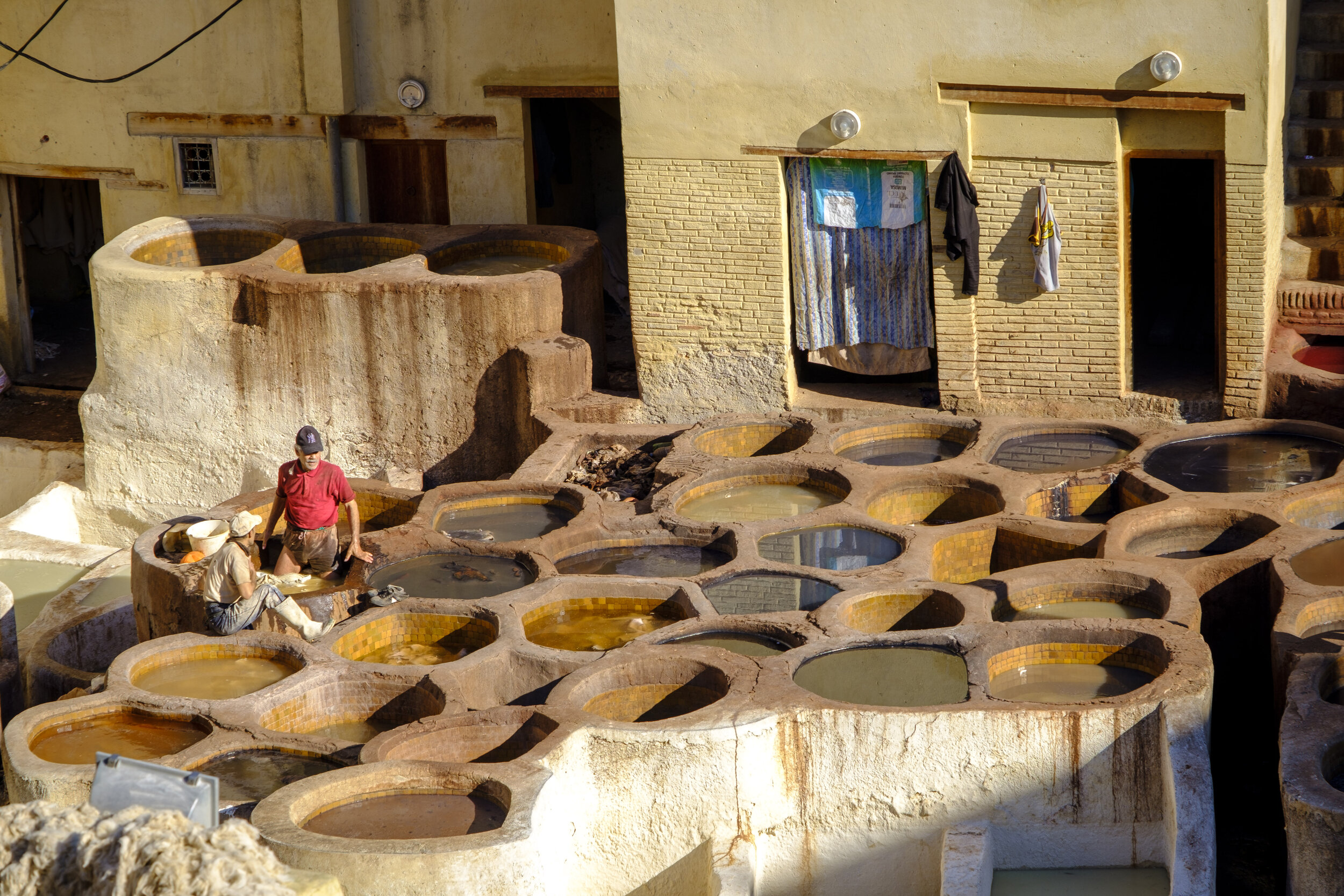  A man works in the dye vats (Photo/Jason Rafal) 