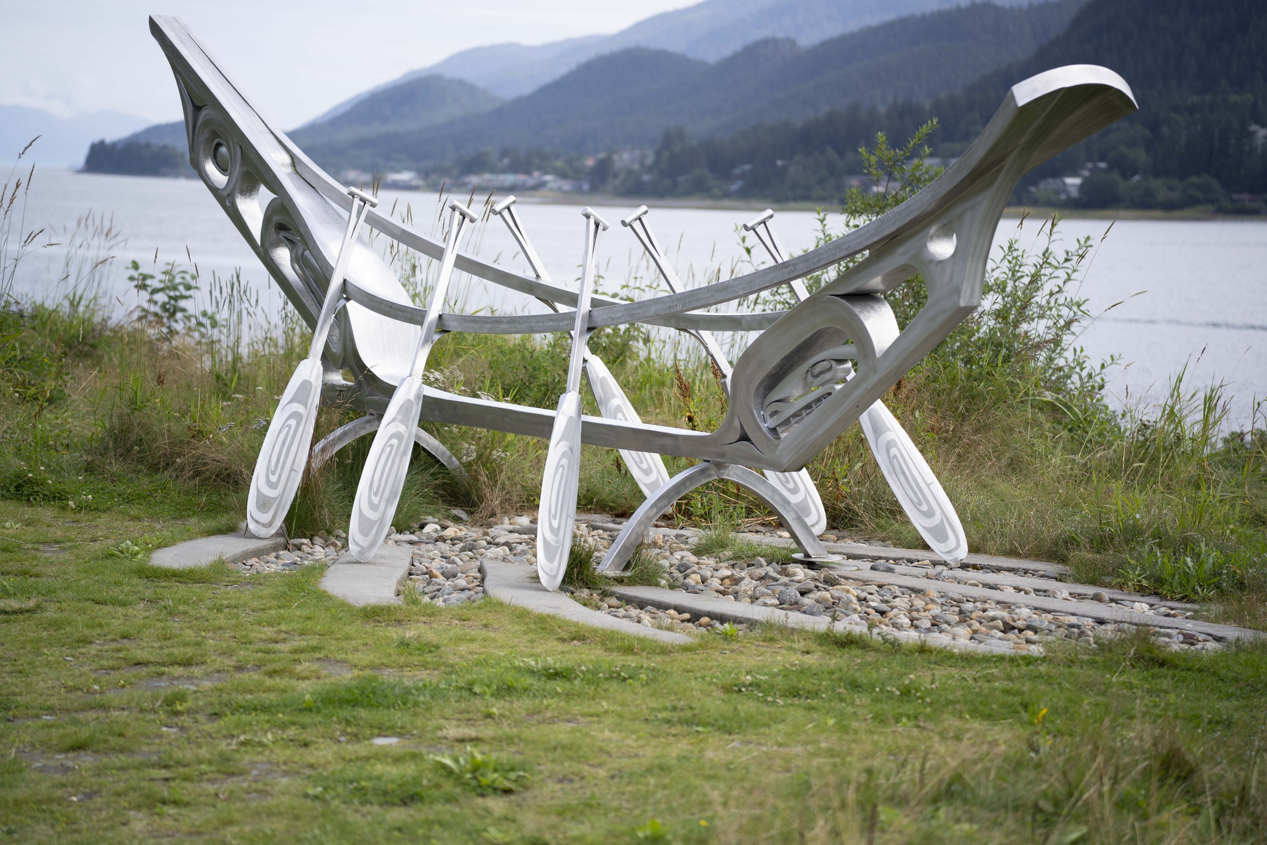 An abstract metal statue of a boat.