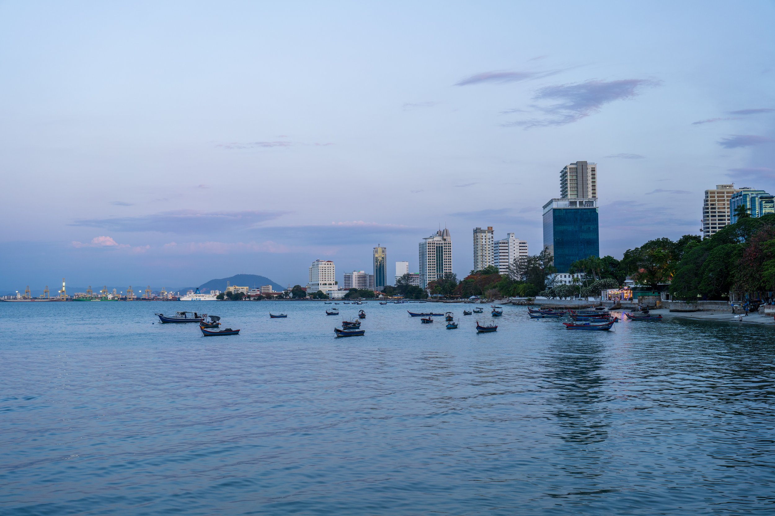 Blue hour looking over a bay with small boats.