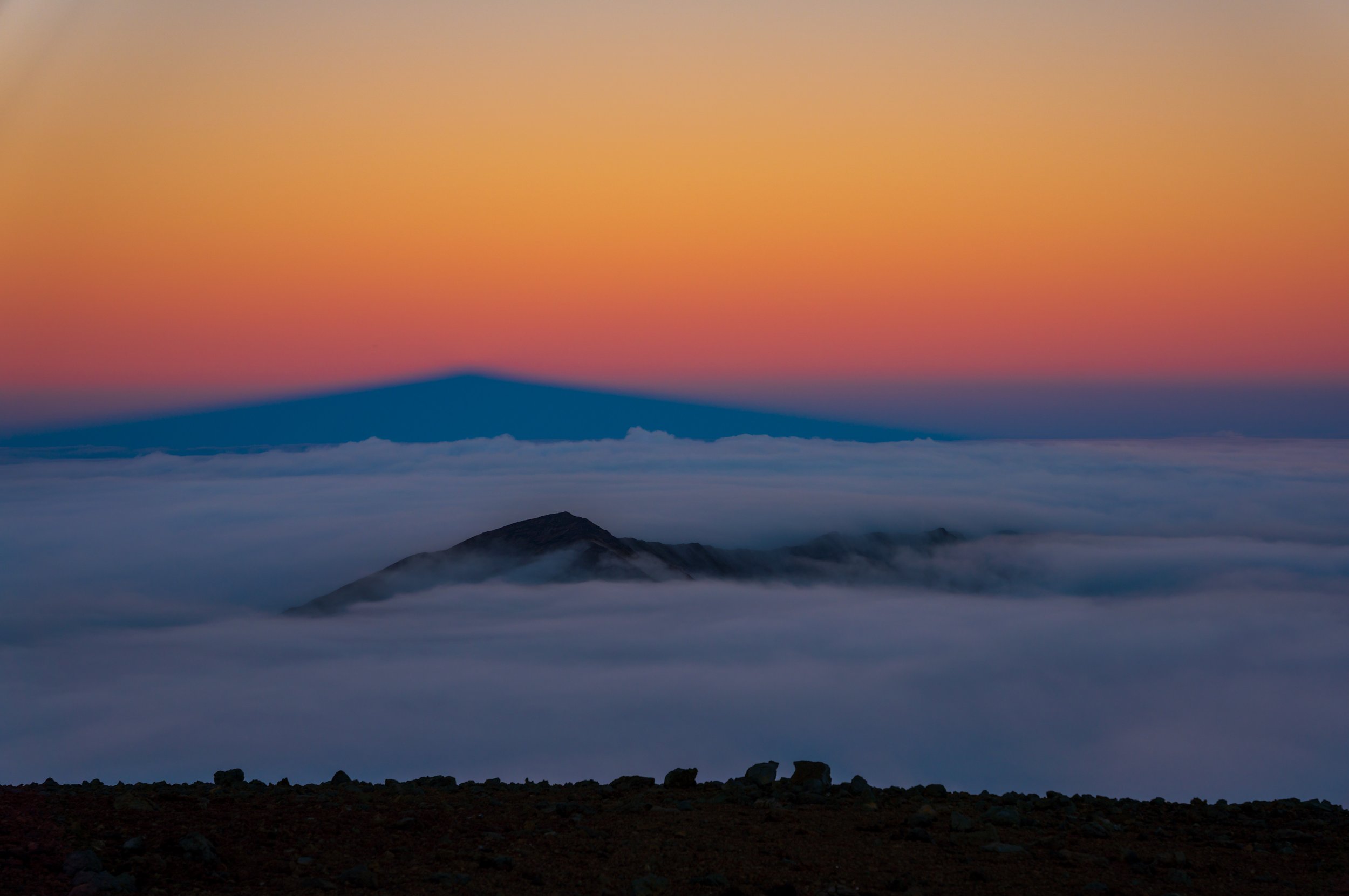  The cloud-covered Haleakala crater with the shadow of the summit behind (photo/Jason Rafal) 