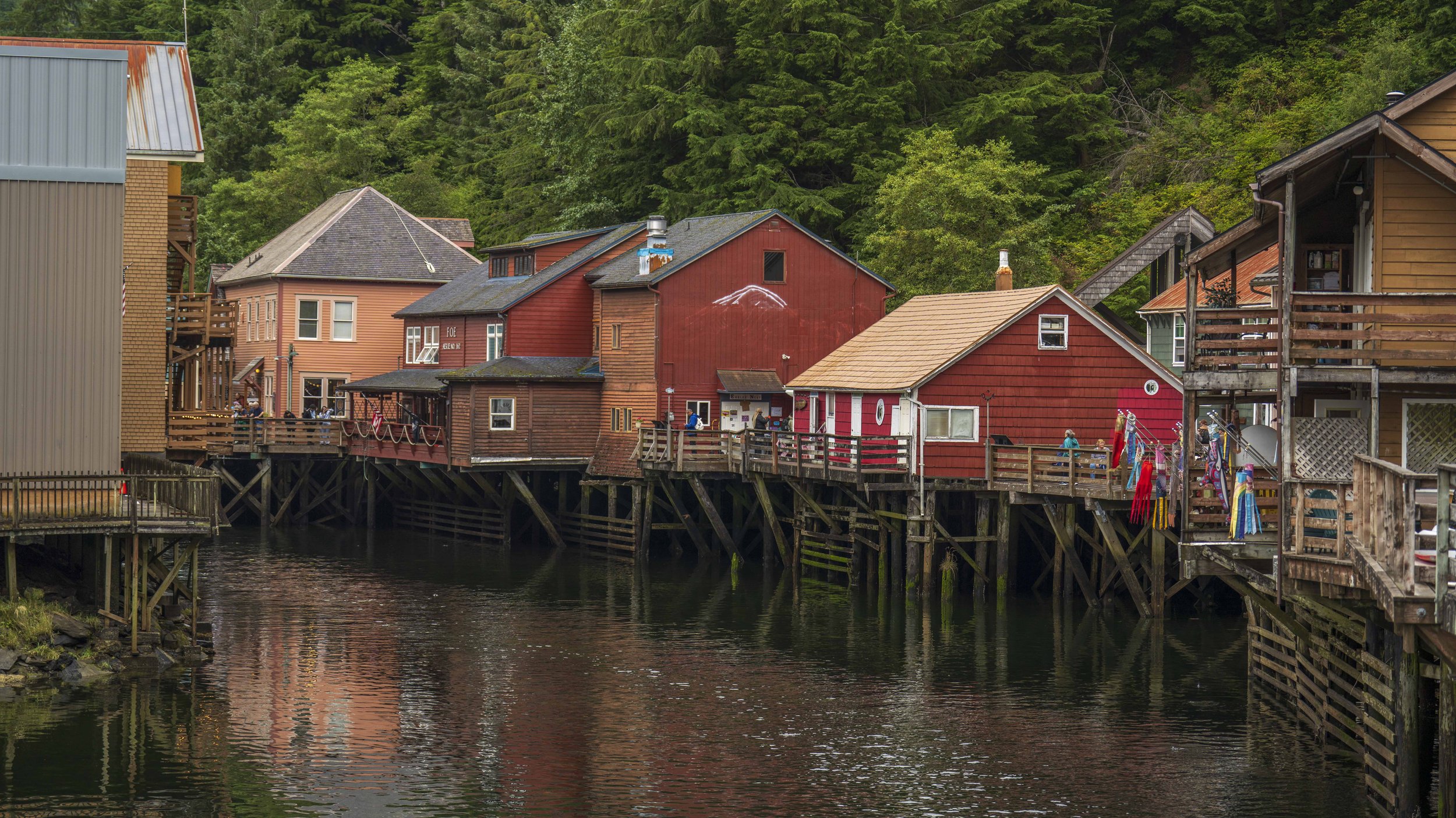 Houses on stilts over a river.