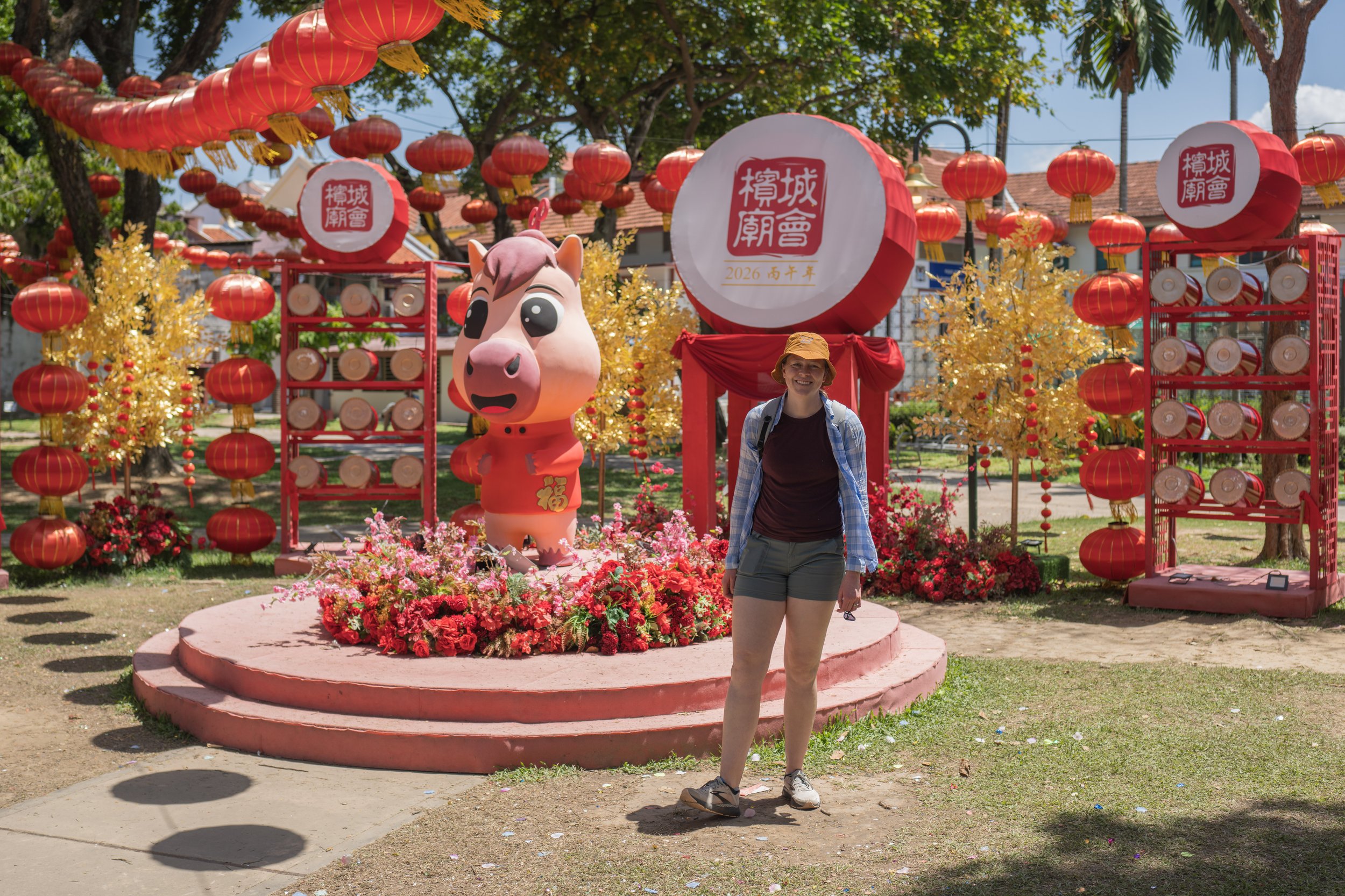 Nicole standing in front of an elaborate year of the horse display.