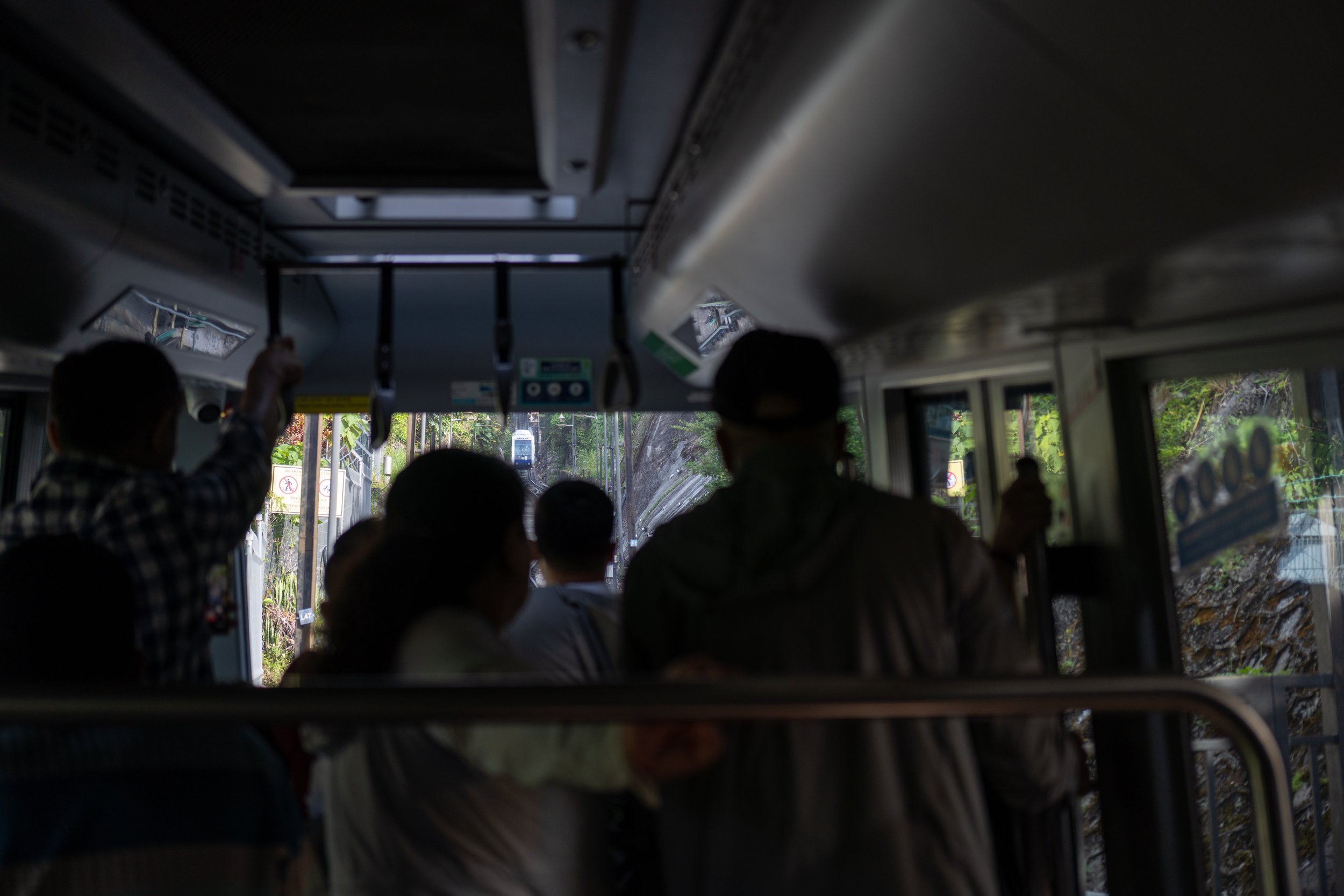 Looking through the windshield at another funicular.