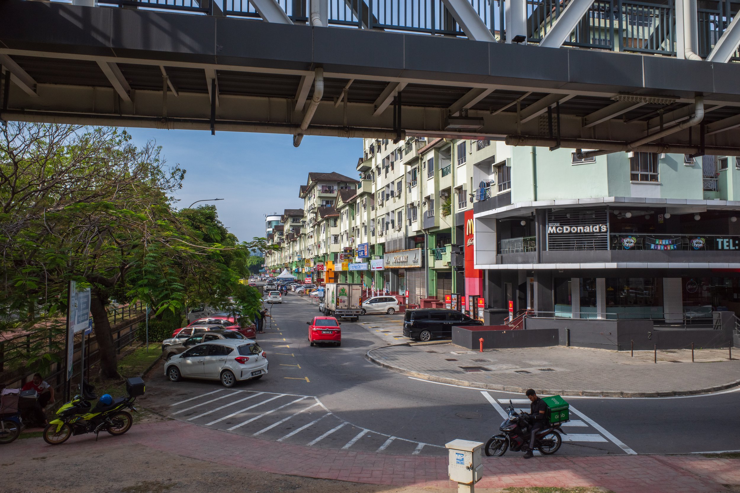 Looking down a mostly empty city street.