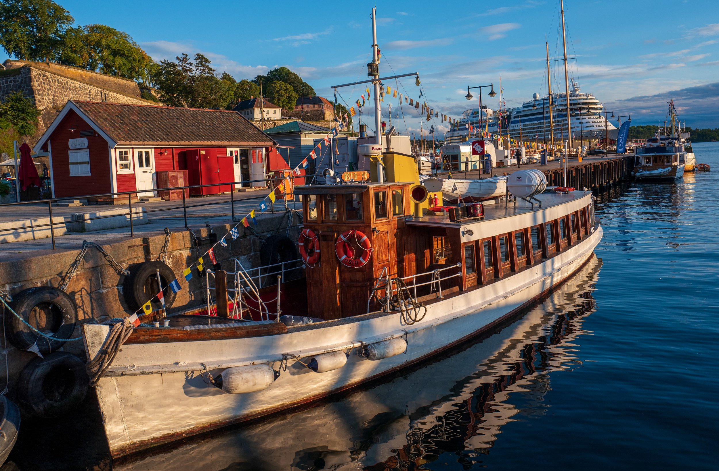 A many-flagged boat in the harbor (photo/Jason Rafal)