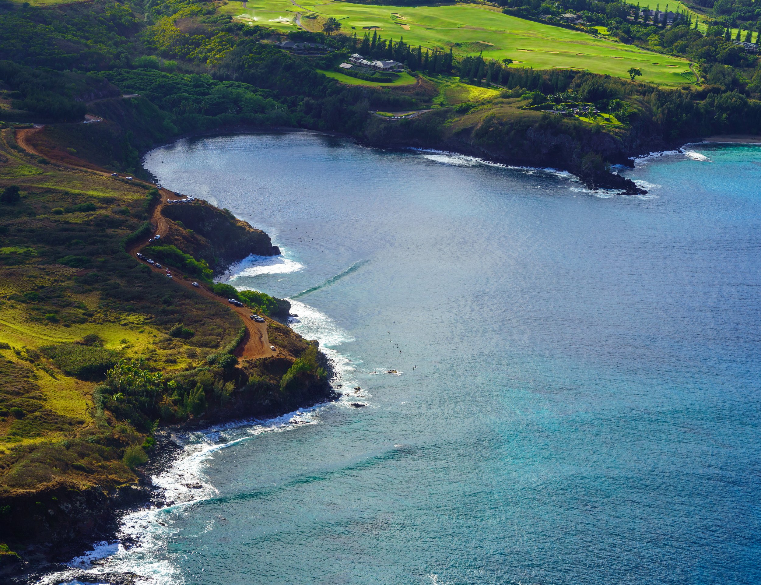  Surfers in the water near Lipoa Point (photo/Jason Rafal) 
