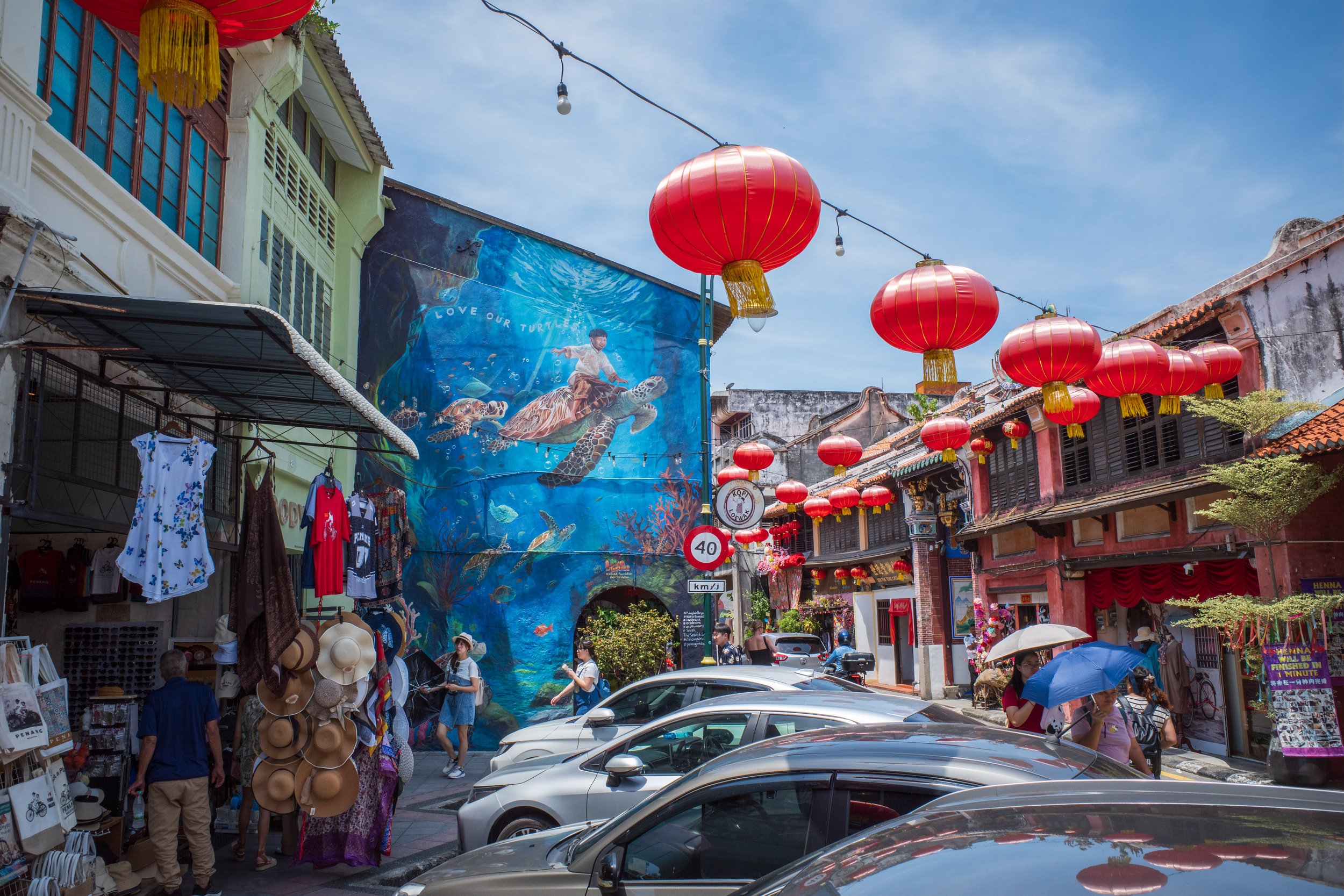 A mural of a boy riding a turtle under water.