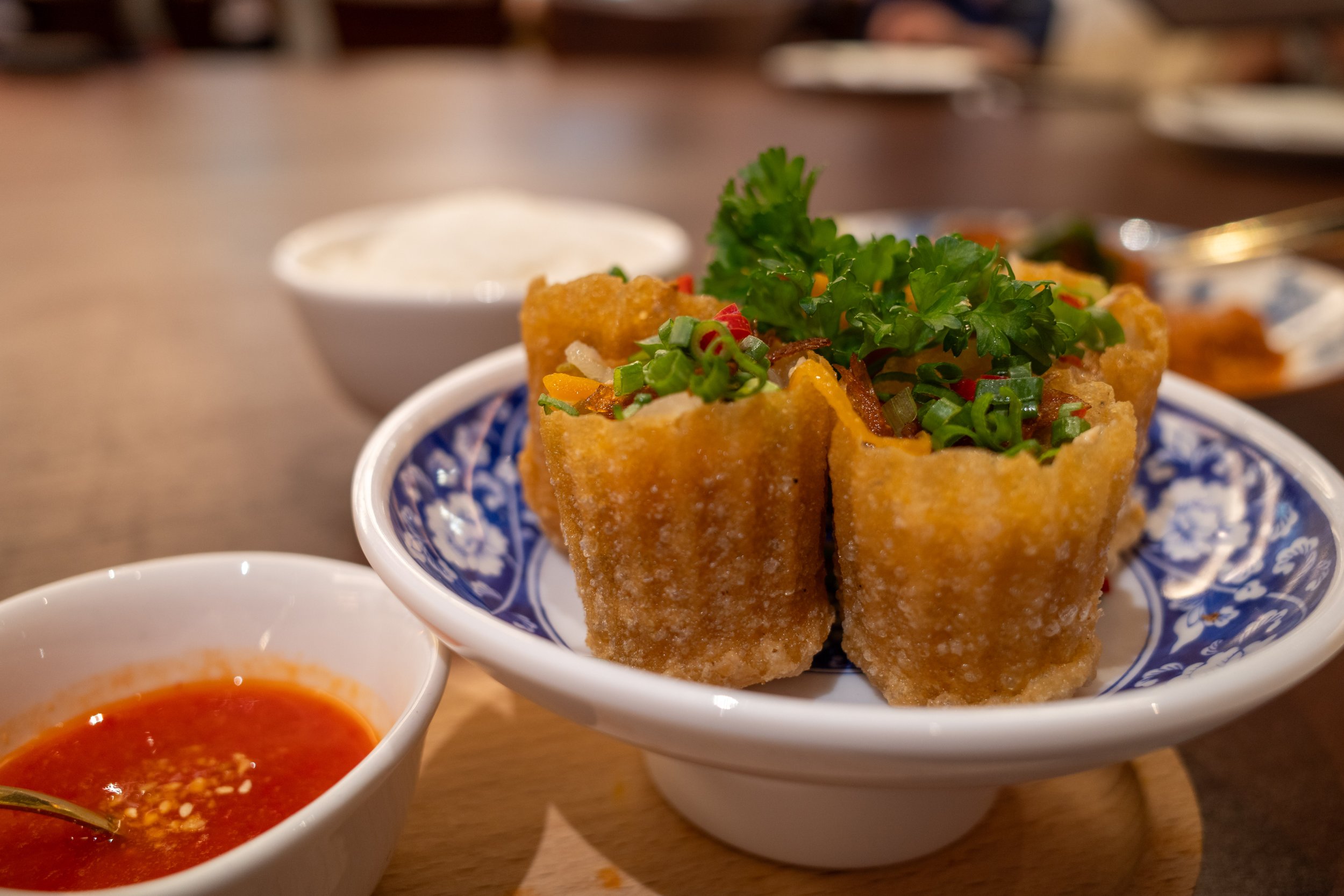 Close up photo of small pastry shell-wrapped food.