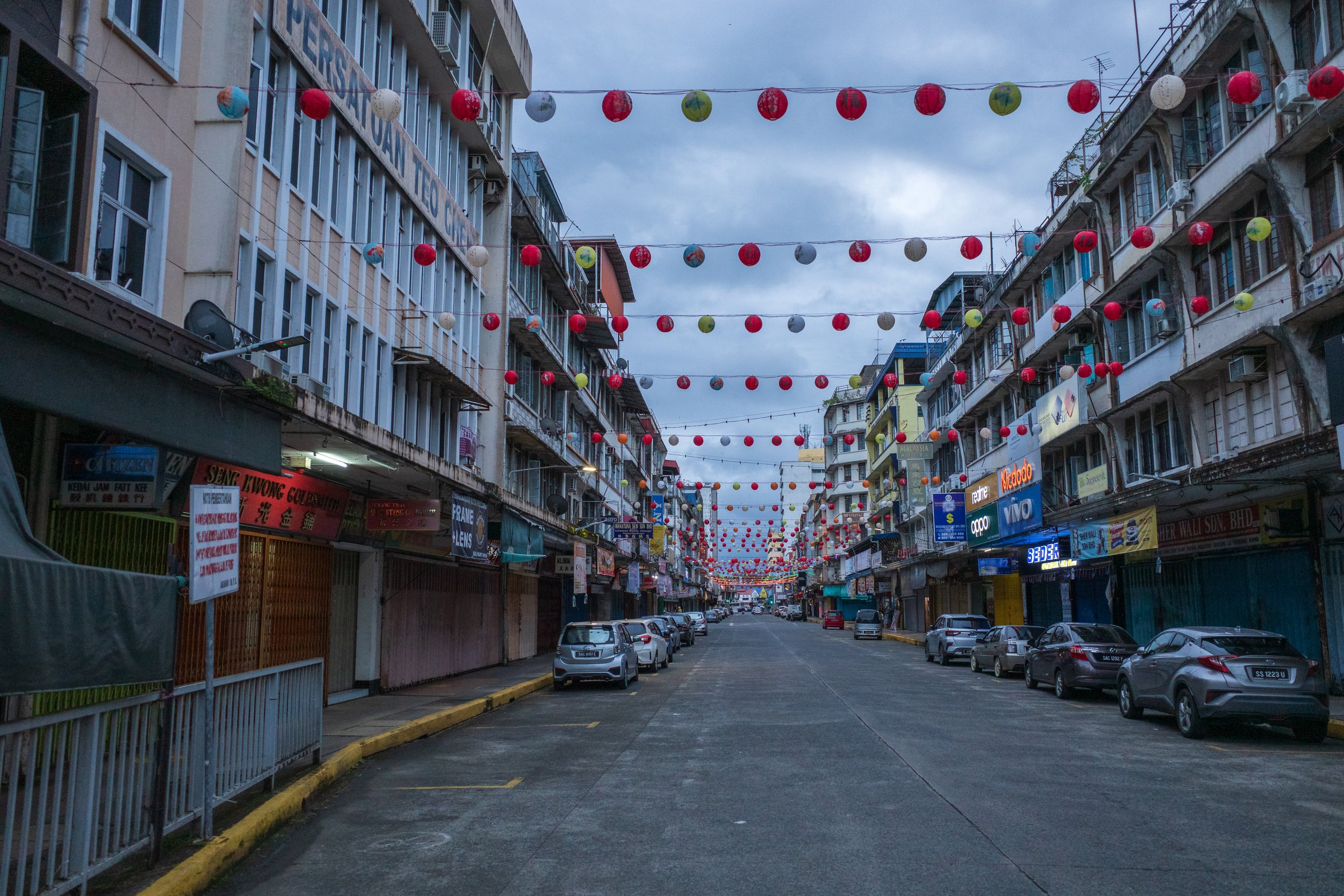 Lanterns hung across a quiet street.