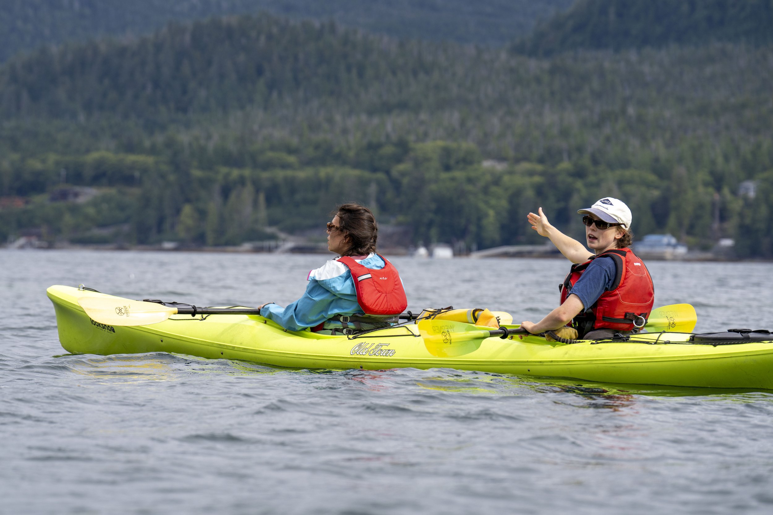 Our kayak guide gesturing toward the water.
