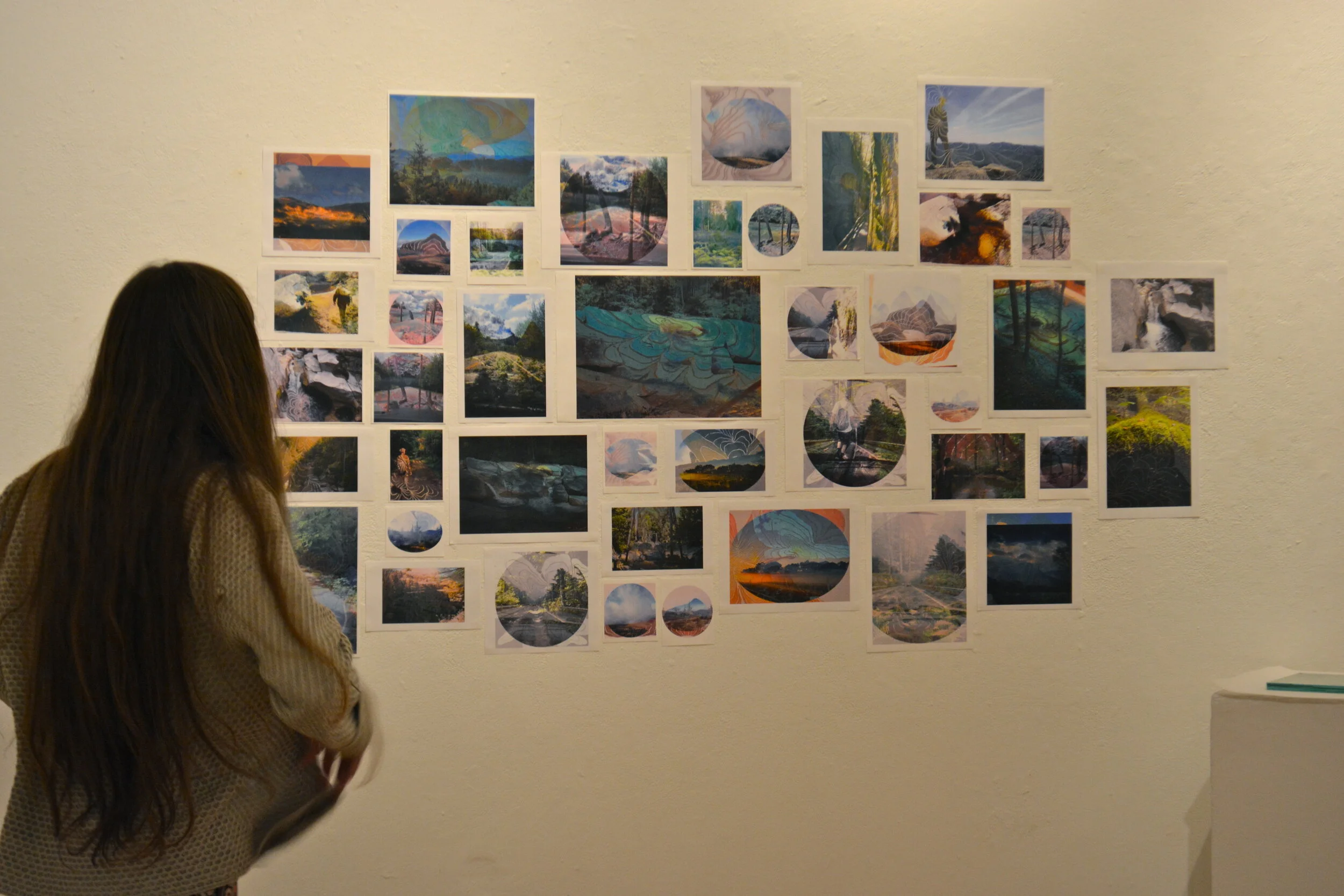  Kayla McKenna (seen left) in front of “Photocollages,” Digital Printouts, Photocollages Review, Arnheim Gallery, MassArt, Boston, MA, 2014 