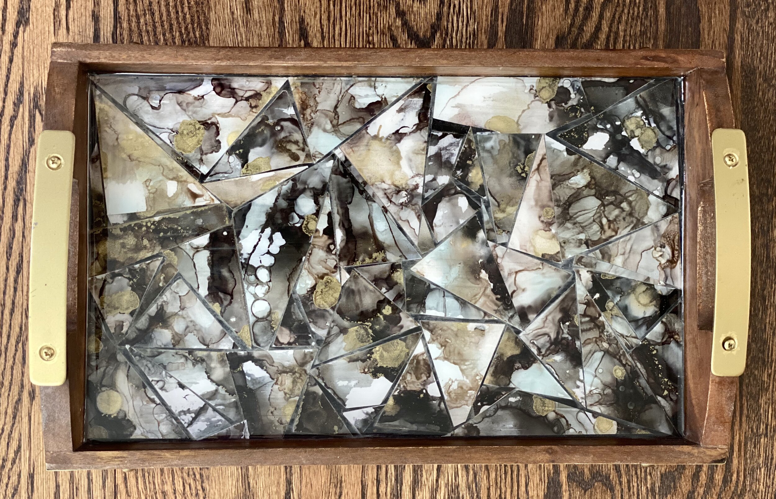 Grey with flashes of silver made with alcohol inks on resin. Rectangle - 16” x 10” $50