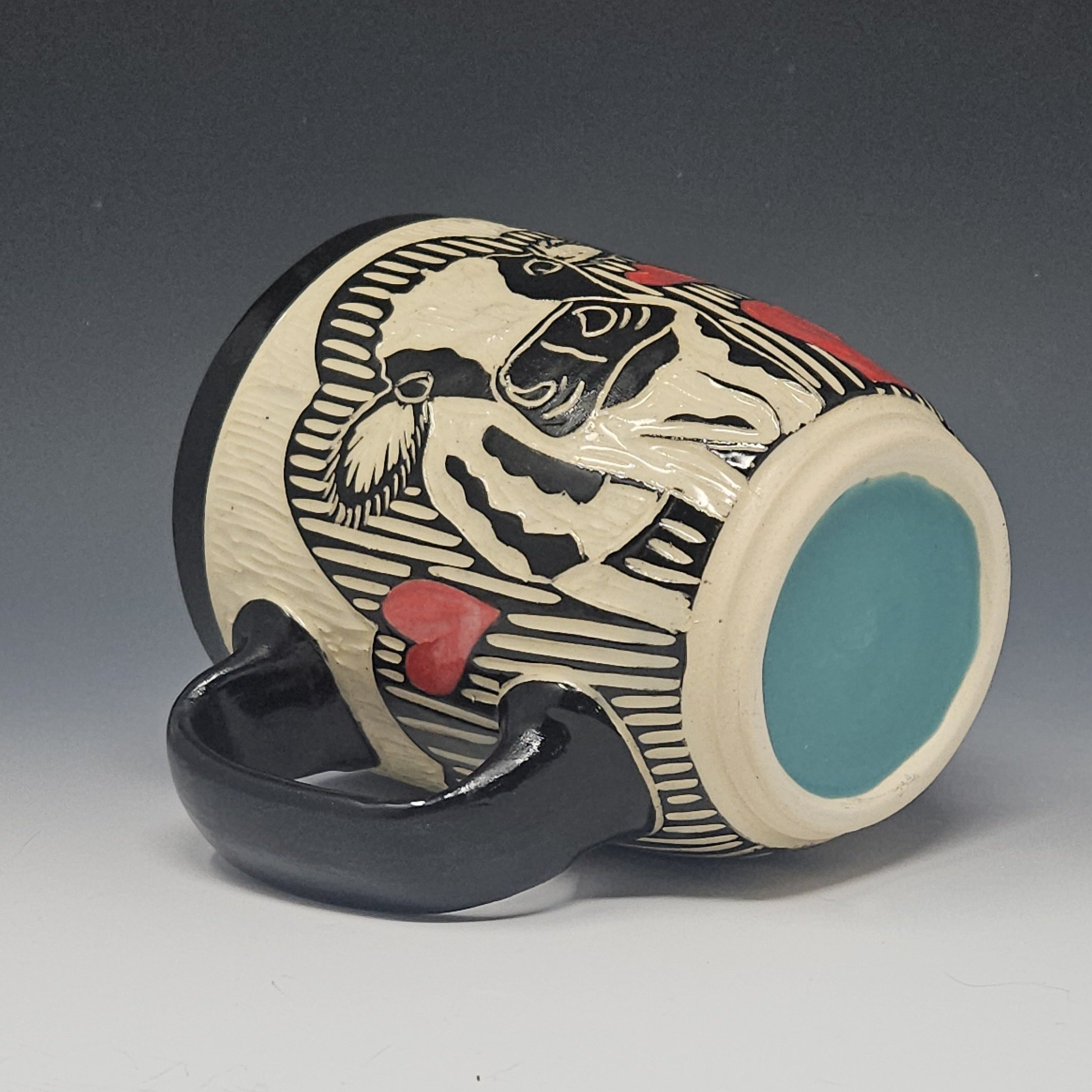 Sgraffito Cow Mug with red hearts. Black and white design with color of your choice for the interior of the coffee mug.