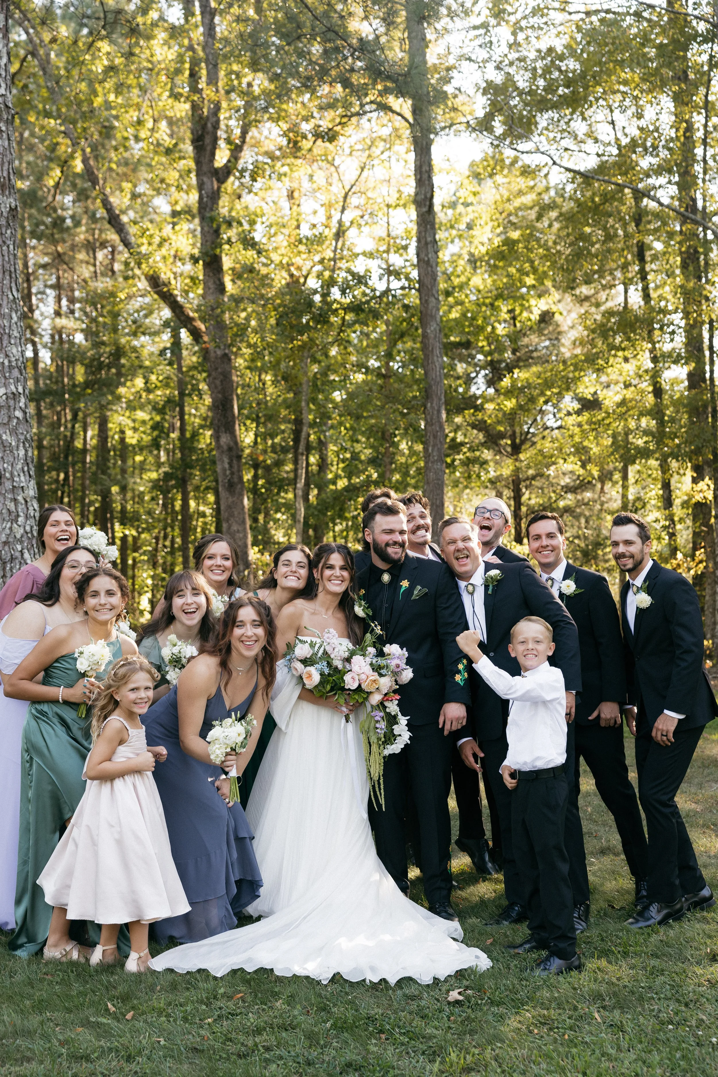 Bride and groom with wedding party holding garden-style bouquets designed by Sweet South Flowers, Cleveland TN wedding florist (2).jpg