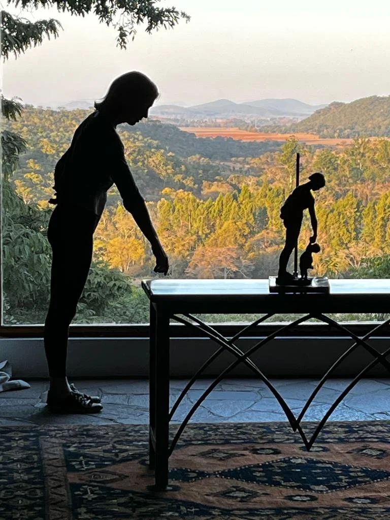 Client demonstrating to Anna that she had sculpted herself