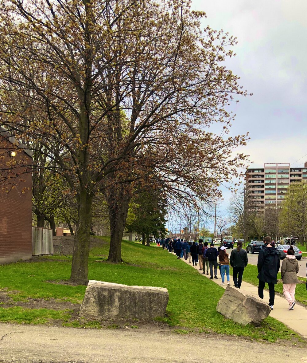 People line at Driftwood Community Centre for a vaccination pop up clinic organized by local groups like LOFT. (Photo credit: Heather McDonald)