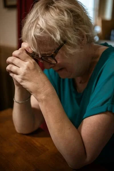 woman crying over loss of spouse