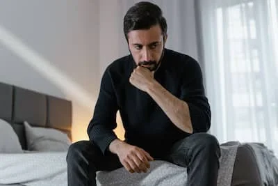 man having negative thoughts