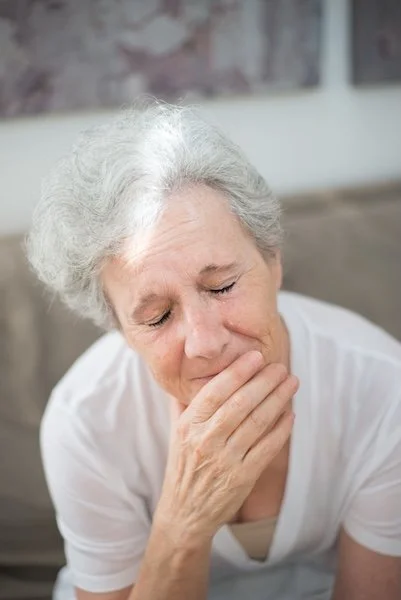 an older woman upset and crying