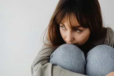 sad woman looking to her right