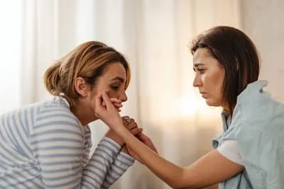 two women apologizing