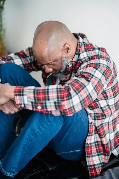 A man on the floor thinking