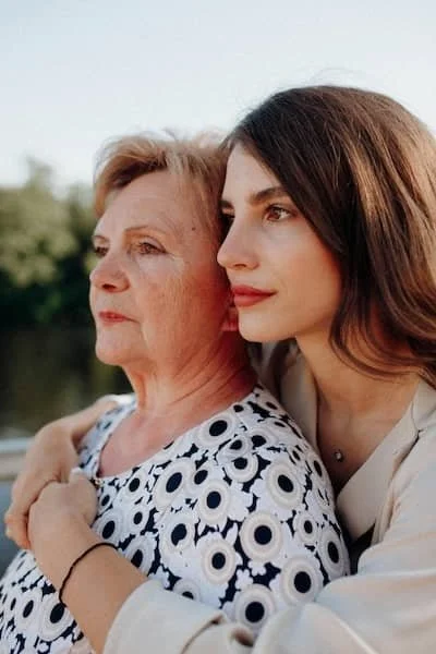A mother and daughter consoling each other