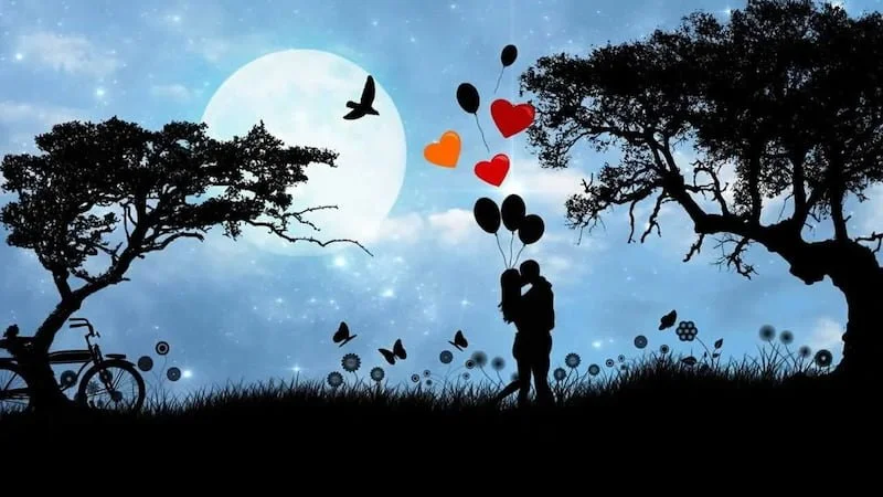 a couple outside with balloons and butterflies at night