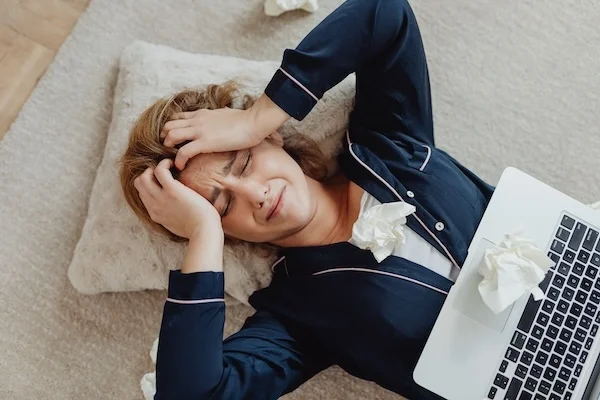 A woman in the floor looking overwhelmed