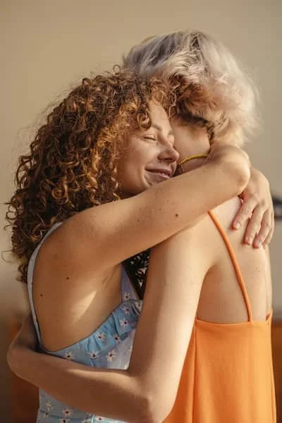 two women making up