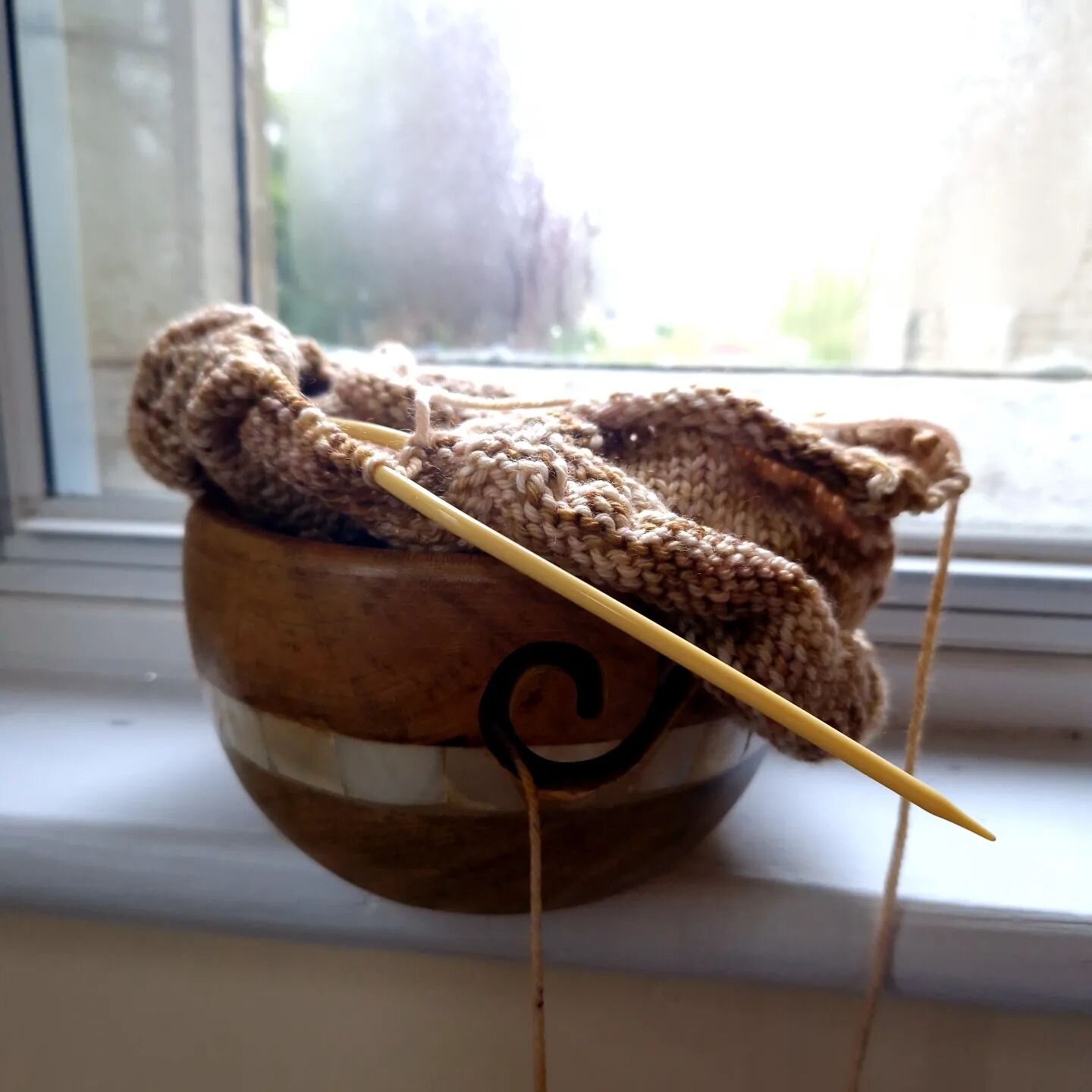 My mom sent me a care package and included this wooden yarn bowl with mother of pearl inlays. It's very pretty and smooth, and I think it matches my yarn choice beautifully. 
.
.
I've never had nor used a yarn bowl before. How do I know whether I'm u