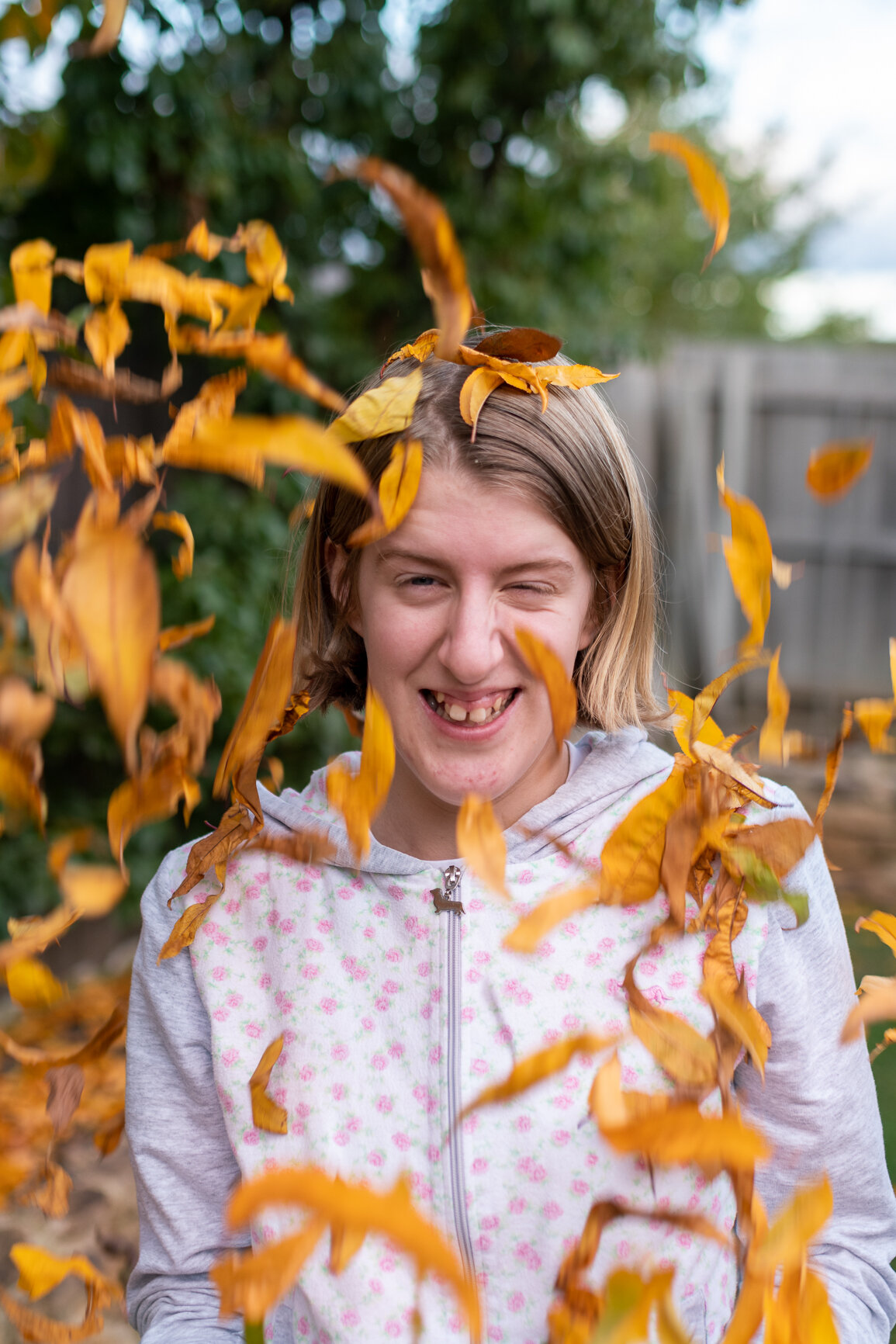 Canberra Family photography: AJ Nitz Images - Girl throws autumn leaves in the air