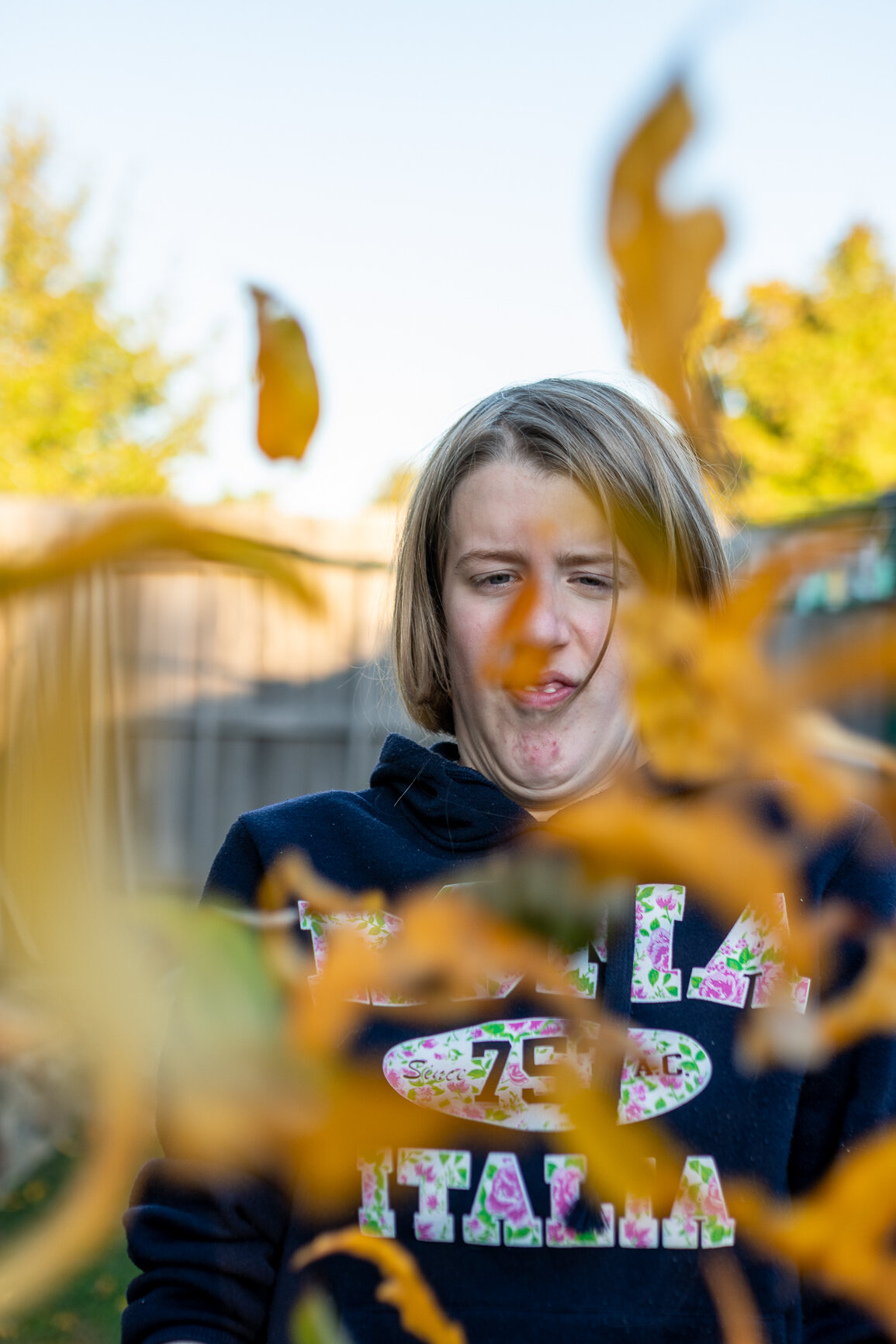 Canberra Family photography: AJ Nitz Images - Girl throws leaves up in the air