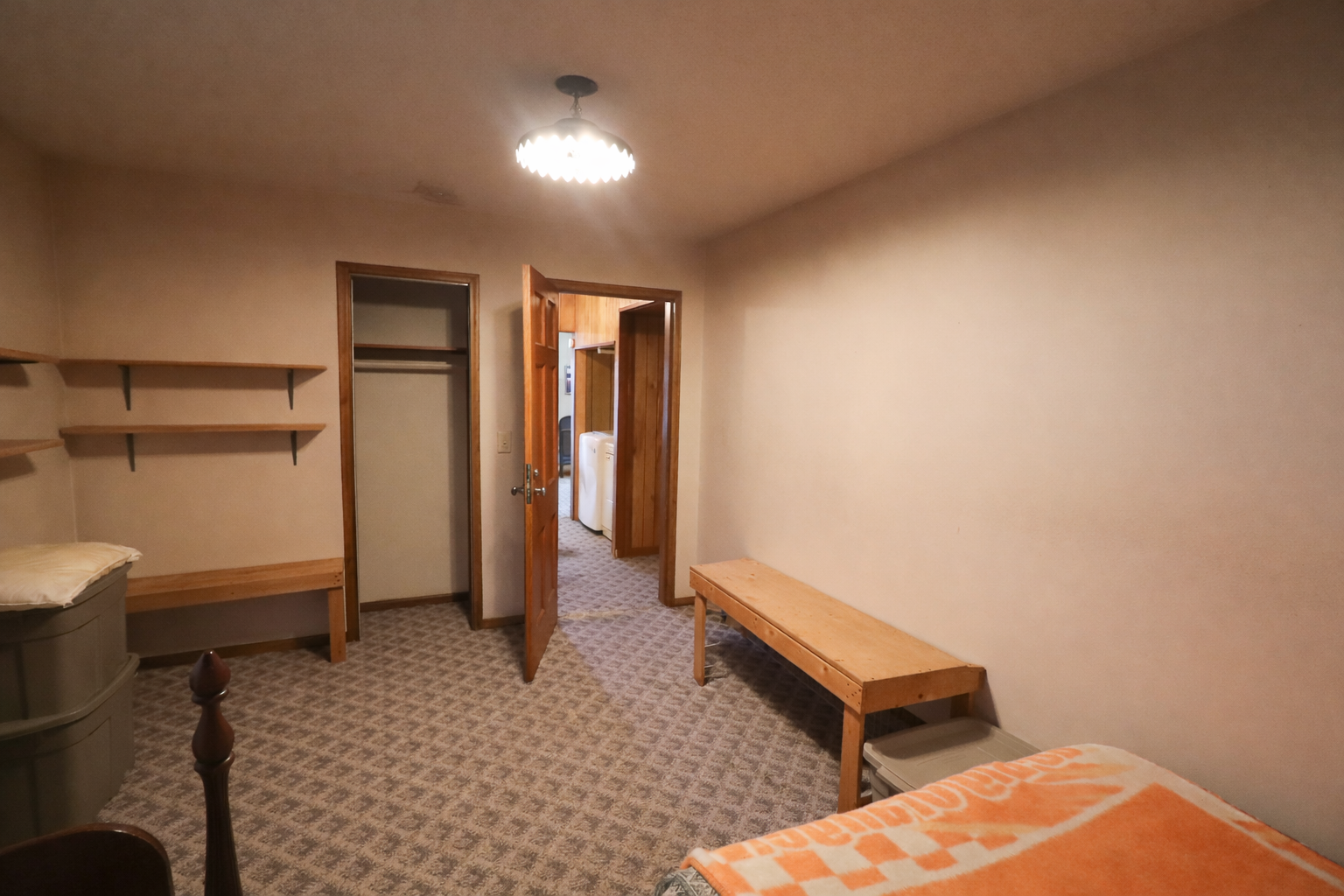 Simple bedroom with open doors.png