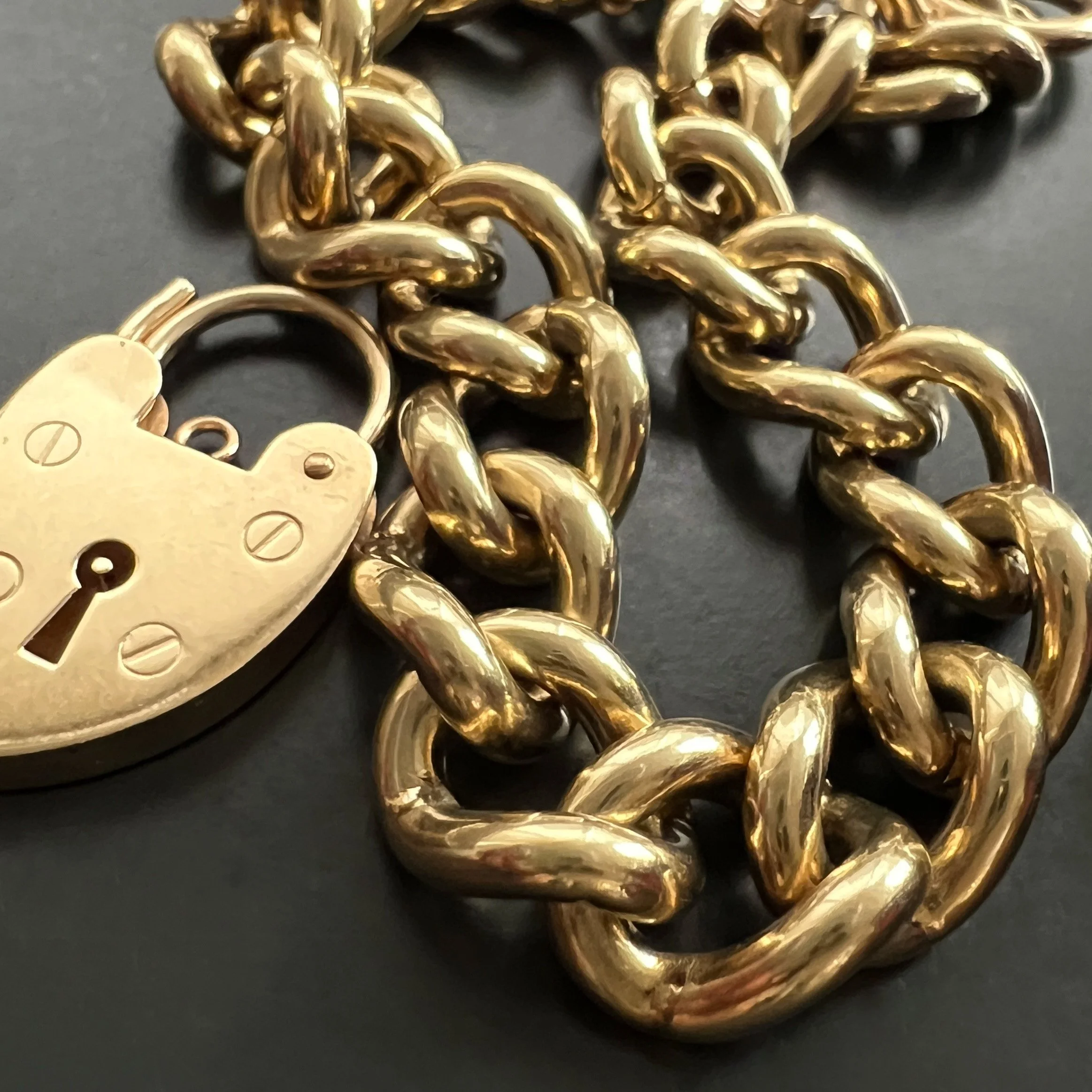 Vintage 1970s Chunky and Heavy Gold Curb Link Bracelet with Heart Padlock