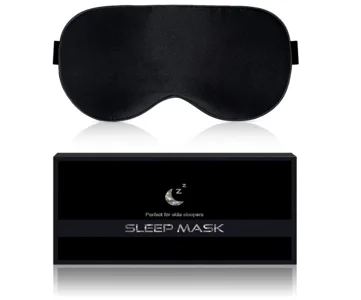 Schwarze Schlafmaske mit elastischem Band, präsentiert oberhalb einer schwarzen Verpackung mit Aufschrift ‚Sleep Mask‘.
