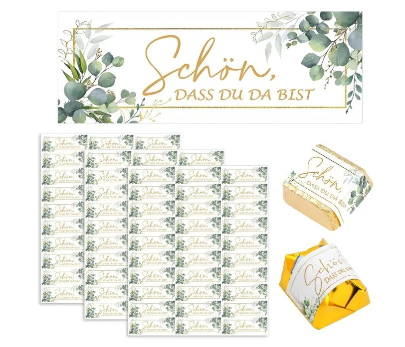 Gastgeschenk-Aufkleber mit floraler Verzierung und dem Schriftzug „Schön, dass du da bist“ in Goldschrift, passend zur Dekoration von kleinen Gastgeschenken wie Schokolade oder Pralinen.