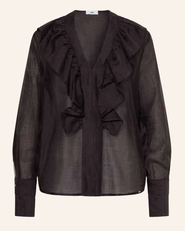 Schwarze, transparente Bluse mit tiefem V-Ausschnitt, breitem Rüschenbesatz, langen Ärmeln und Knopfmanschetten.