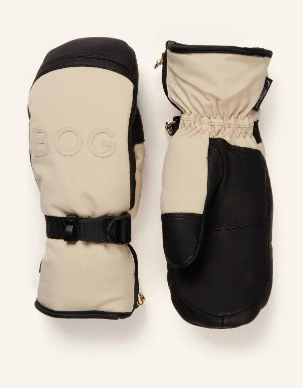 Exklusive Bogner-Ski-Fäustlinge im Two-Tone-Design (Creme/Schwarz). Leder-Funktionsmix, geprägtes BOG‑Logo, verstellbarer Handgelenksriegel — warmes, funktionales Luxus-Accessoire.