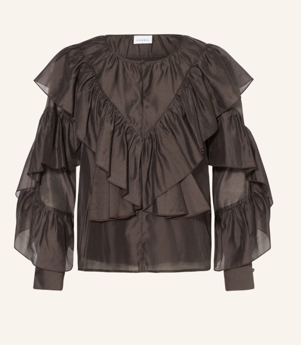 Schokobraune, transparente Bluse mit großflächigen, gestuften Volants über Schultern und Ärmeln in V-Form.